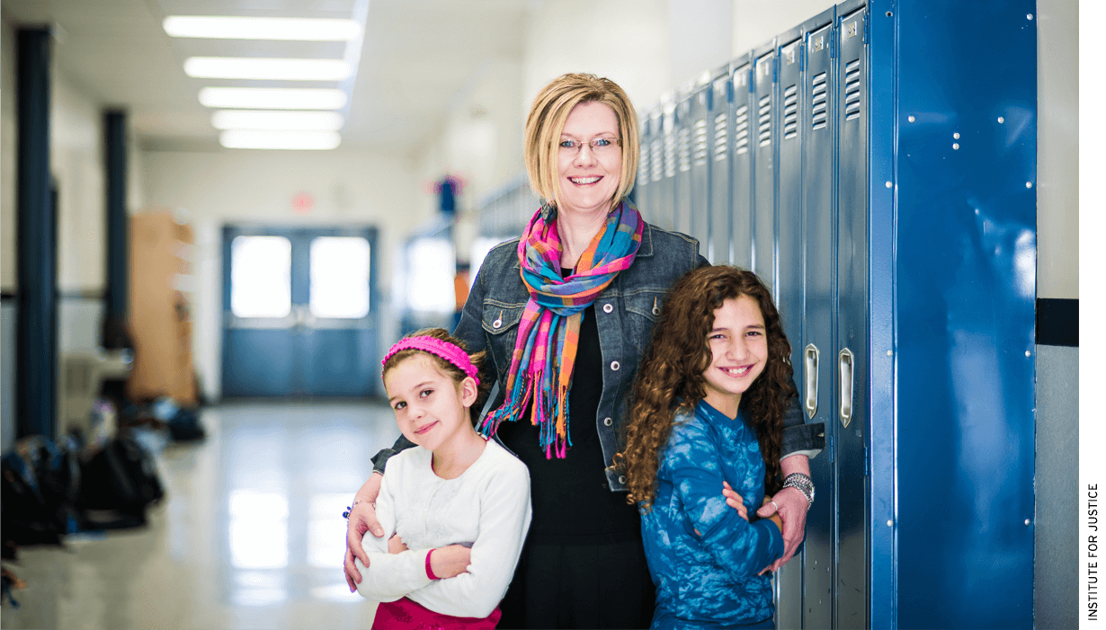 Kendra Espinoza with her two daughters at Stillwater Christian School in Kalispell, Mont.