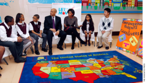 First Lady Michelle Obama and Newark Mayor Cory Booker sit with children at the Maple Avenue School in Newark, N.J., Thursday, Nov. 18, 2010.