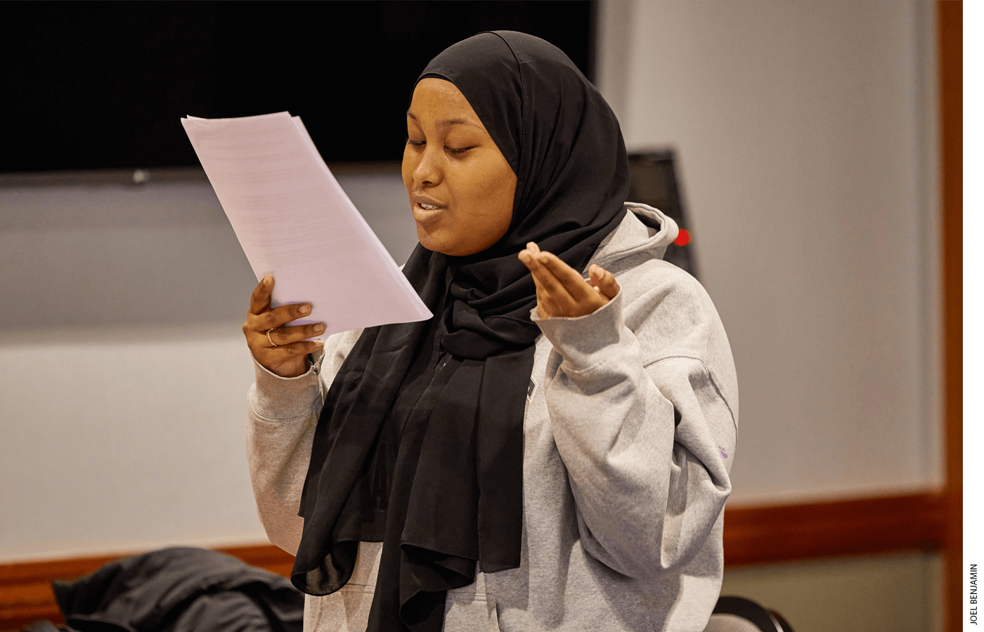 Aisha Mohamed, a novice-level debater with Josiah Quincy Upper School, delivers her opening speech at the tournament, reading from prepared evidence.