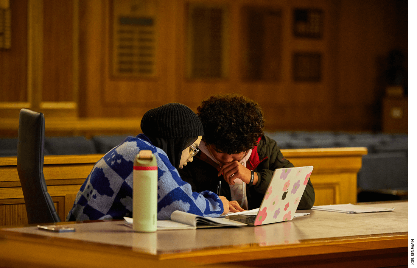 Shahed Ananzeh and Gustavo Dos Santos, students at the Boston International Newcomers Academy, work together to prepare for an upcoming speech during a Boston Debate League tournament at Suffolk University Law School in February.