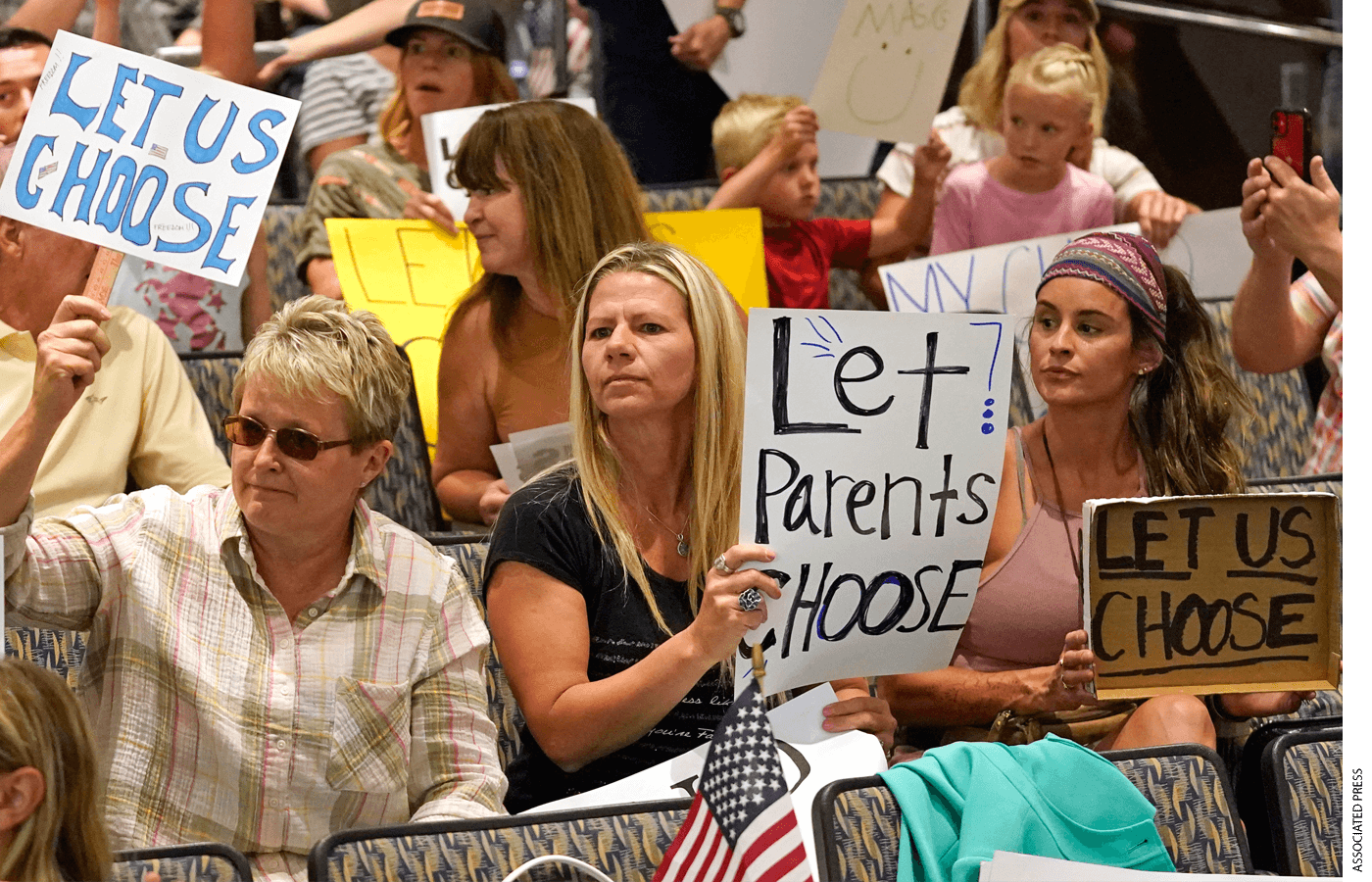 People listen to the Salt Lake County Council before their vote to overturned the health department's "order of restraint" on Thursday, Aug. 12, 2021, that would have required K-6 students to wear masks when school starts next week.