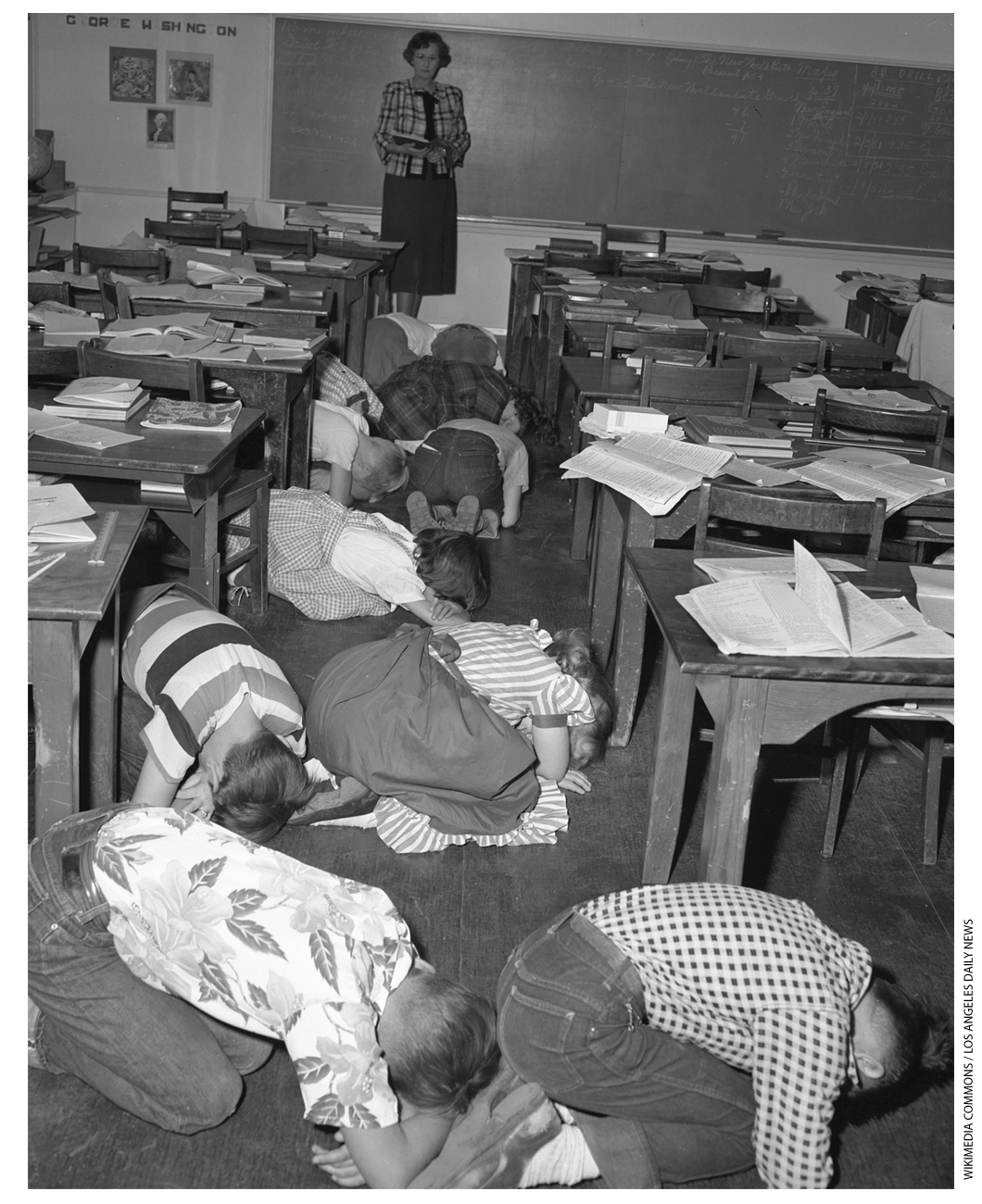 Children ducking during an atom bomb drill.